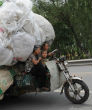 Much of the developing world relies on cheap, inefficient and dangerous scooters, as a main form of transportation. Image of Much of the developing world relies on cheap, inefficient and dangerous scooters, as a main form of transportation.