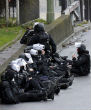 Police and SWAT team sit outside kosher deli market in Paris where Amedy Coulibaly has reportedly taken six hostages. Image of Police and SWAT team sit outside kosher deli market in Paris where Amedy Coulibaly has reportedly taken six hostages.