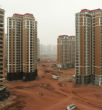 One of China's many ghost towns. Built at the height of a massive real estate boom, many Chinese cities and suburbs now lay empty. Image of One of China's many ghost towns. Built at the height of a massive real estate boom, many Chinese cities and suburbs now lay empty.