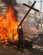 Christians often have to face brutal violence from Muslims, just because they're Christians. Image of Christians often have to face brutal violence from Muslims, just because they're Christians.
