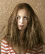 Don't let your hair drag you down anymore; tie it up and take control. Image of Don't let your hair drag you down anymore; tie it up and take control.
