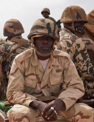 A Mali soldier sits in a truck. Mali has been engaged in a civil war since 2012. Image of A Mali soldier sits in a truck. Mali has been engaged in a civil war since 2012.