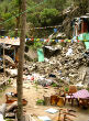 An avalanche of boulders destroyed the remote village the American couple was visiting. Image of An avalanche of boulders destroyed the remote village the American couple was visiting.