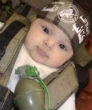 ISIS has posted many pictures of babies dressed in ISIS garb with weapons. Image of ISIS has posted many pictures of babies dressed in ISIS garb with weapons.