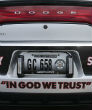 'In God We Trust' bumper sticker on a patrol car. Image of 'In God We Trust' bumper sticker on a patrol car.