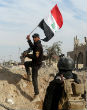Iraqi troops raise the country's flag in the government center of Ramadi. Image of Iraqi troops raise the country's flag in the government center of Ramadi.