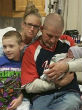 Image of Young boy not allowed to share images of stillborn little brother in school project on family (Cassandra Hess).