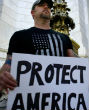 Protesters stand in snow (not pictured) to stand against new influx of refugees into America (AP). Image of Protesters stand in snow (not pictured) to stand against new influx of refugees into America (AP).