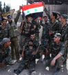 Syrian troops reached Palmyra while Iraqi troops launched an attack against Mosul. Image of Syrian troops reached Palmyra while Iraqi troops launched an attack against Mosul.
