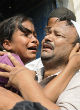 The girl's sister was inconsolable during the funeral (AFP/Getty Images). Image of The girl's sister was inconsolable during the funeral (AFP/Getty Images).