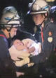 Rescuers discover 8-month-old baby in the rubble of a crumbled building (BBC). Image of Rescuers discover 8-month-old baby in the rubble of a crumbled building (BBC).