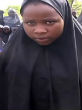 One of the Chibok girls spoke to the camera. It is the first time her family has seen her in two years. Image of One of the Chibok girls spoke to the camera. It is the first time her family has seen her in two years.