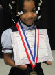 Anaya Ellick won an award for having the best handwriting despite not having hands (Facebook). Image of Anaya Ellick won an award for having the best handwriting despite not having hands (Facebook).