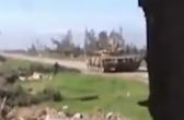 Syrian rebel throws grenade into tank. Image of Syrian rebel throws grenade into tank.
