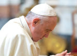 Pope Francis prays for women. Image of Pope Francis prays for women.
