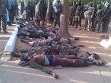 Boko Haram soldiers hovering over innocents whom they slaughterd in the name of their Image of Boko Haram soldiers hovering over innocents whom they slaughterd in the name of their