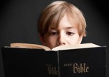 Children were allowed to bring their Bibles to school. Image of Children were allowed to bring their Bibles to school.