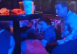 Blue Parrot nightclub patrons huddle under tables as shots ring out (Marcos Vazquez/Twitter). Image of Blue Parrot nightclub patrons huddle under tables as shots ring out (Marcos Vazquez/Twitter).
