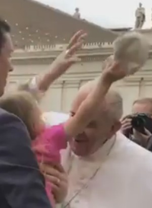 Estella removed Pope Francis' skullcap when the Pontiff leaned in for a kiss. Estella removed Pope Francis' skullcap when the Pontiff leaned in for a kiss.
