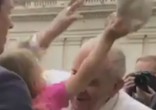 Estella removed Pope Francis' skullcap when the Pontiff leaned in for a kiss. Image of Estella removed Pope Francis' skullcap when the Pontiff leaned in for a kiss.