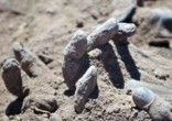 The sight of the bodies dumped in the mass grave brought one soldier to tears. Image of The sight of the bodies dumped in the mass grave brought one soldier to tears.