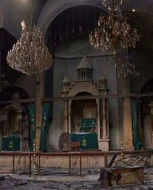 Priest visits Catholic church (not pictured) after ISIS clears out. Priest visits Catholic church (not pictured) after ISIS clears out.