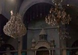 Priest visits Catholic church (not pictured) after ISIS clears out. Image of Priest visits Catholic church (not pictured) after ISIS clears out.