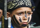 Cubs of the Caliphate are being used to guard Mosul from Christians attempting to return home. Image of Cubs of the Caliphate are being used to guard Mosul from Christians attempting to return home.