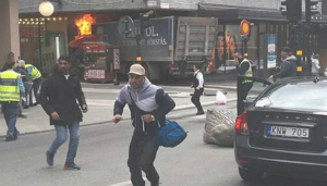 People flee as the terrorist attacker drives into a department store. People flee as the terrorist attacker drives into a department store.