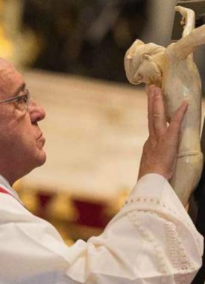 Pope Francis venerates the cross on Good Friday 2015 (L'Osservatore Romano). Pope Francis venerates the cross on Good Friday 2015 (L'Osservatore Romano).