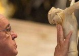 Pope Francis venerates the cross on Good Friday 2015 (L'Osservatore Romano). Image of Pope Francis venerates the cross on Good Friday 2015 (L'Osservatore Romano).