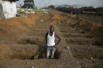 A man digs a grave for Ebola victims during the outbreak in West Africa. The 2014-1026 outbreak was the most serious in history and its global spread was only prevented by swift action by international health officials. A man digs a grave for Ebola victims during the outbreak in West Africa. The 2014-1026 outbreak was the most serious in history and its global spread was only prevented by swift action by international health officials.