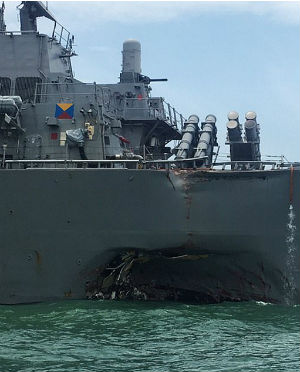 The USS John S. McCain suffers significant damage after a collision with a Liberian-flagged oil tanker. The USS John S. McCain suffers significant damage after a collision with a Liberian-flagged oil tanker.