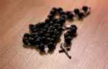 An unnamed woman was found dead with rosary beads stuffed into her mouth. Image of An unnamed woman was found dead with rosary beads stuffed into her mouth.