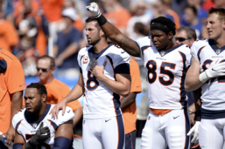 Some players saluted, others protested during the playing of the national anthem at Sunday's football games. Some players saluted, others protested during the playing of the national anthem at Sunday's football games.