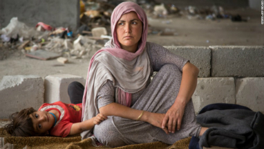 A Yazidi refugee woman with her child. ISIS slaughtered thousands of Yazidi and Christian minorities during their rampage though Syria and Iraq. A Yazidi refugee woman with her child. ISIS slaughtered thousands of Yazidi and Christian minorities during their rampage though Syria and Iraq.