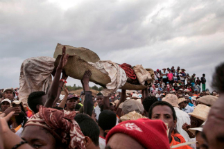 Health officials have blamed ceremonies that involve digging up the dead and reburying them for the current outbreak, but this has not been confirmed. Still, they have asked people to halt the practice. Health officials have blamed ceremonies that involve digging up the dead and reburying them for the current outbreak, but this has not been confirmed. Still, they have asked people to halt the practice.
