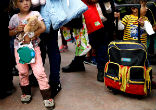 Many from the caravan fleeing violence were traveling with young children. Image of Many from the caravan fleeing violence were traveling with young children.