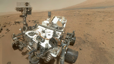 A selfie from the Curiosity rover. Curiosity looks small but is actually the size of a compact car. Fun Fact: Mars is the only planet inhabited entirely by robots. A selfie from the Curiosity rover. Curiosity looks small but is actually the size of a compact car. Fun Fact: Mars is the only planet inhabited entirely by robots.