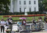 Facing the Pentagon, we held signs calling for an end to all nuclear weapons. Image of Facing the Pentagon, we held signs calling for an end to all nuclear weapons.