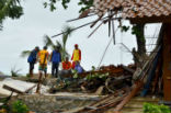 Officials look through the wreckage of damaged buildings in Carita, Indonesia on December 23, 2018. Credit: AFP/Getty Images. Image of Officials look through the wreckage of damaged buildings in Carita, Indonesia on December 23, 2018. Credit: AFP/Getty Images.