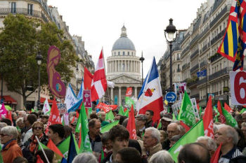 Protesters wave flags and hold signs Protesters wave flags and hold signs
