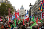 Protesters wave flags and hold signs Image of Protesters wave flags and hold signs