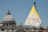 View of St. Peters Basilica and Vatican City flag Image of View of St. Peters Basilica and Vatican City flag
