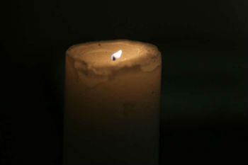 Lit candle at the memorial for Orlando at St. Patrick's Catholic Church in Rome Lit candle at the memorial for Orlando at St. Patrick's Catholic Church in Rome