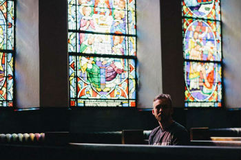 Young man in church Image of Young man in church