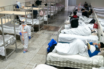 Patients in a hospital in China remain under quarantine while the illness spreads. Image of Patients in a hospital in China remain under quarantine while the illness spreads.