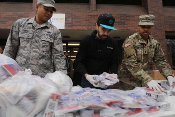 National Guard members hand out food to residents near a one mile radius containment area set up to halt coronavirus March 12 2020 in New Rochelle New York Image of National Guard members hand out food to residents near a one mile radius containment area set up to halt coronavirus March 12 2020 in New Rochelle New York