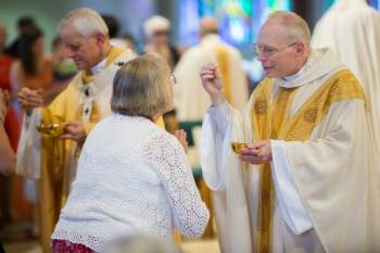 Several diocese are issuing new guidelines for Communion and other practices to prevent the spread of germs. Image of Several diocese are issuing new guidelines for Communion and other practices to prevent the spread of germs.