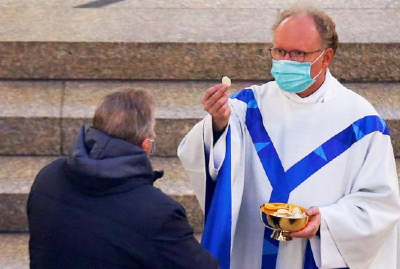 Canon Law does not have rules regarding priests and masks while administering the Sacraments. However, there should be some limits observed when it comes to COVID restrictions. Image of Canon Law does not have rules regarding priests and masks while administering the Sacraments. However, there should be some limits observed when it comes to COVID restrictions.